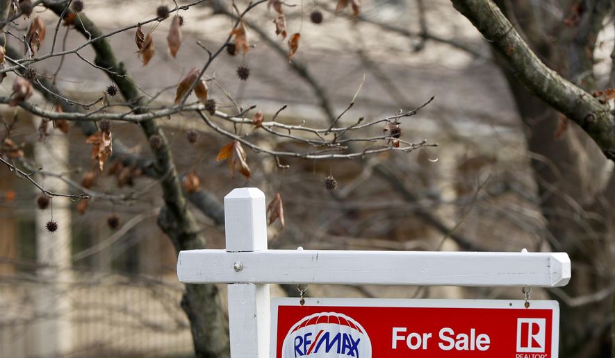 FILE- In this Jan. 3, 2019, file photo a realtor sign marks a home for sale in Franklin Park, Pa. On Tuesday, Jan. 22, the National Association of Realtors reports on sales of existing homes in December. (AP Photo/Keith Srakocic, File)