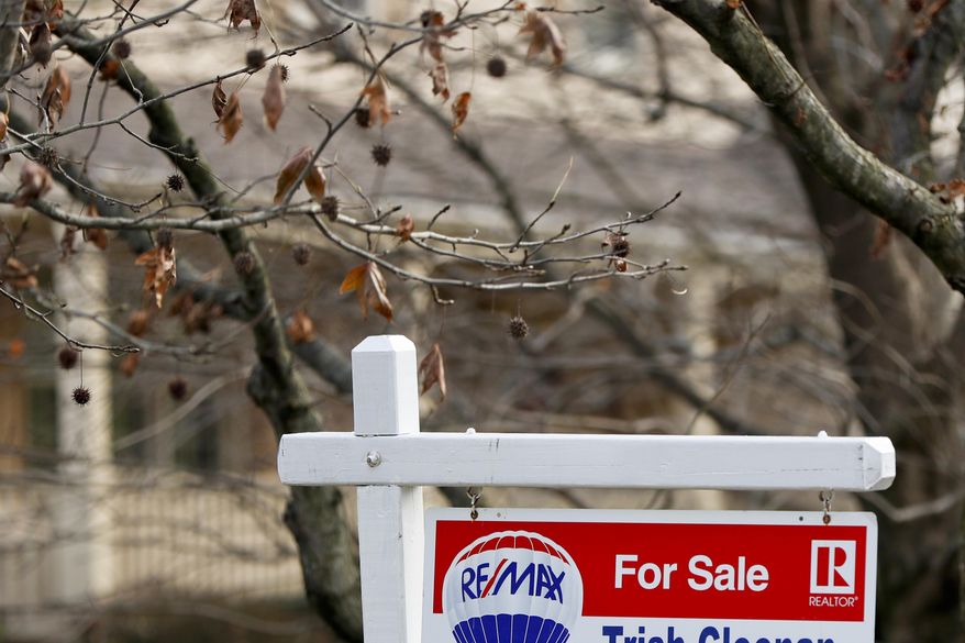 FILE- In this Jan. 3, 2019, file photo a realtor sign marks a home for sale in Franklin Park, Pa. On Tuesday, Jan. 22, the National Association of Realtors reports on sales of existing homes in December. (AP Photo/Keith Srakocic, File)