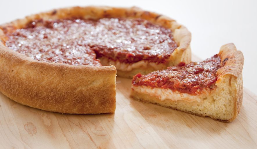 This undated photo provided by America's Test Kitchen in January 2019 shows a Deep-Dish Pizza in Brookline, Mass. This recipe appears in the cookbook "Bread Illustrated." (Carl Tremblay/America's Test Kitchen via AP)