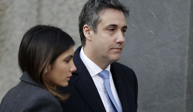 FILE - In this Dec. 12, 2018, file photo, Michael Cohen, right, President Donald Trump&#x27;s former lawyer, arrives at federal court for his sentencing in New York. (AP Photo/Julio Cortez, File)