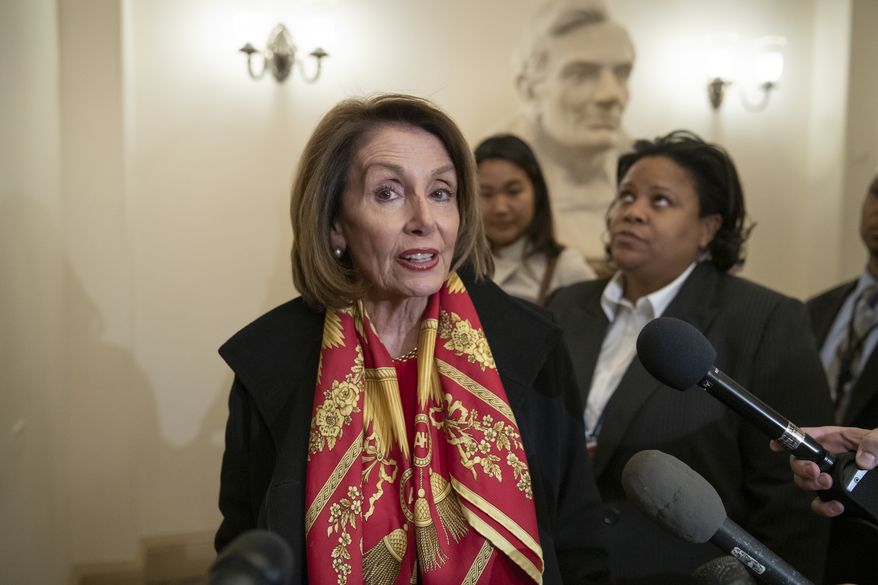 Speaker of the House Nancy Pelosi, D-Calif., responds to reporters after officially postponing President Donald Trump&#x27;s State of the Union address until the government is fully reopened, at the Capitol in Washington, Wednesday, Jan. 23, 2019. The California Democrat told Trump in a letter Wednesday the Democratic-controlled House won&#x27;t pass the required measure for him to give the nationally televised speech from the House floor. (AP Photo/J. Scott Applewhite)