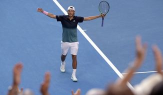 France&#39;s Lucas Pouille celebrates after defeating Canada&#39;s Milos Raonic in their quarterfinal match at the Australian Open tennis championships in Melbourne, Australia, Wednesday, Jan. 23, 2019. (AP Photo/Mark Schiefelbein)