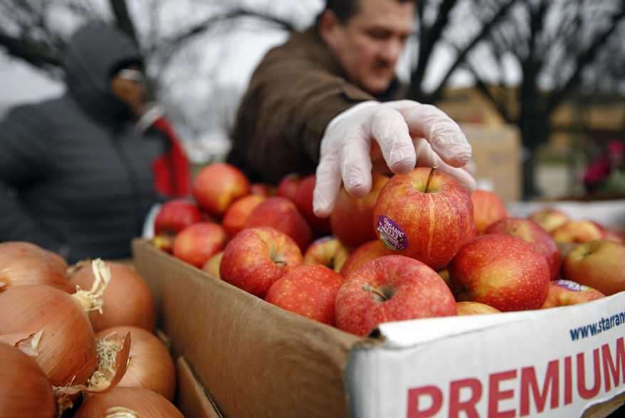 Volunteers prepare for a food pantry for furloughed government workers affected by the federal shutdown, Wednesday, Jan. 23, 2019, in Baltimore. (AP Photo/Patrick Semansky)
