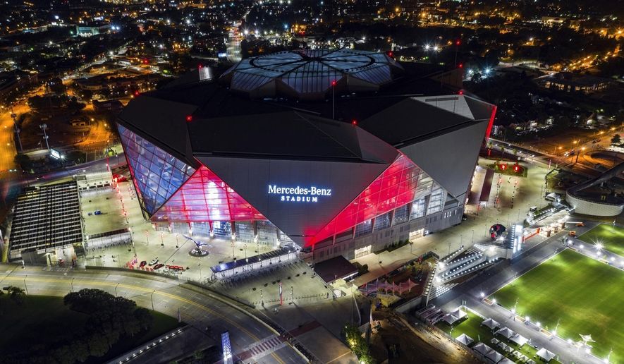 FILE-In this Friday, Sep. 21, 2018, photo, Mercedes-Benz Stadium is seen in this aerial photo in Atlanta. The stadium will be the site of Super Bowl LIII on Sunday, Feb. 3, 2019. Legions of police and federal agents will be protecting the stadium as Atlanta hosts Super Bowl 53, but recent attacks in the U.S. and around the world underscore how terrorists are striking less-secure areas outside sports stadiums, arenas and airports, experts say.(AP Photo/Danny Karnik, File)