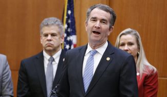 Virginia Gov. Ralph Northam, front, speaks as House speaker, Kirk Cox, left, and State Sen. Amanda Chase, R-Chesterfield, right, during a press conference relating to a bipartisan agreement on a coal ash bill at the Capitol in Richmond, Va., Thursday, Jan. 24, 2019. (AP Photo/Steve Helber) ** FILE **