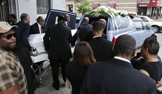 FILE - In this June 16, 2015 file photo, the casket bearing Kalief Browder is loaded into a hearse after his funeral service in the Bronx borough of New York. On Thursday, Jan. 24, 2019, New York City officials said that the City will pay $3 million to Browder&#39;s family. Browder&#39;s long detention, nearly half of it spent in solitary confinement at the Rikers Island jail and suicide at age 22, made him a symbol of a broken justice system. (AP Photo/Frank Franklin II, File)
