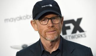 FILE - In this Sept. 16, 2018, file photo, filmmaker Ron Howard poses at a private cocktail party to celebrate the FX network&#39;s Emmy nominations in Los Angeles. Howard is planning to make a documentary about a California town’s attempt to rebuild after the destruction of the 2018 California wildfires. National Geographic Documentary Films announced the project Thursday which will focus on the Sierra Nevada foothills town of Paradise, California. In November of 2018, the wildfires took over 14,000 homes and displaced over 50,000 people. Its working title is “Rebuilding Paradise.” (Photo by Chris Pizzello/Invision/AP, File)