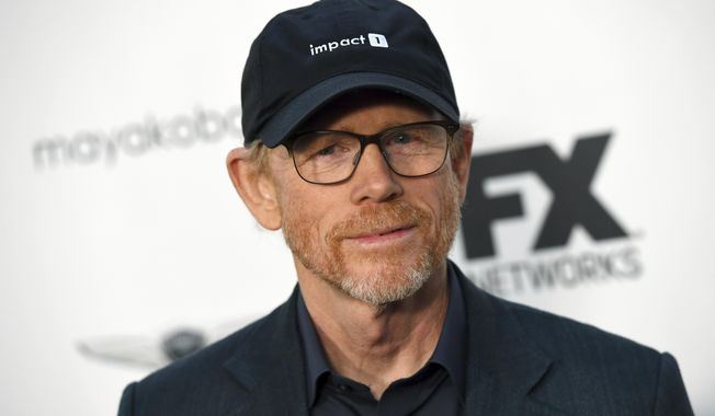 FILE - In this Sept. 16, 2018, file photo, filmmaker Ron Howard poses at a private cocktail party to celebrate the FX network&#x27;s Emmy nominations in Los Angeles. Howard is planning to make a documentary about a California town’s attempt to rebuild after the destruction of the 2018 California wildfires. National Geographic Documentary Films announced the project Thursday which will focus on the Sierra Nevada foothills town of Paradise, California. In November of 2018, the wildfires took over 14,000 homes and displaced over 50,000 people. Its working title is “Rebuilding Paradise.” (Photo by Chris Pizzello/Invision/AP, File)