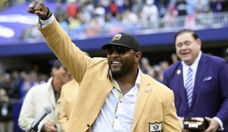 FILE - In this Sept. 23, 2018, file photo, former Baltimore Ravens linebacker Ray Lewis displays his Hall of Fame ring of excellence that he received at a halftime ceremony during an NFL football game between the Ravens and the Denver Broncos, in Baltimore. Lewis is using the celebrity spotlight which will accompany Super Bowl 53 to bring exposure to his Ray of Hope Foundation.  Lewis is throwing a big-ticket party, expected to attract dozens of sports and entertainment stars, to raise money for the foundation. (AP Photo/Nick Wass, File)