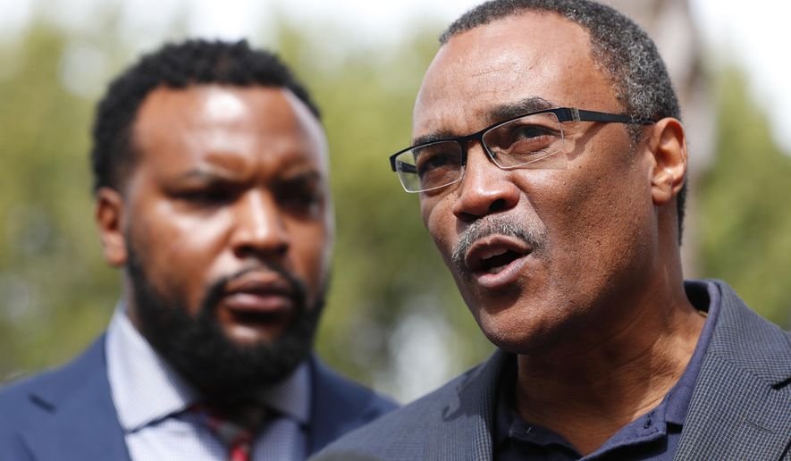 Don Horn, right, Chief Assistant State Attorney for Administration, speaks during a news conference along with attorney Lee Merritt, left, representing a group of teenagers, Thursday, Jan. 24, 2019, in Miami. Video surfaced of a traffic confrontation between the teens, who were demonstrating in the streets, and Mark Bartlett, who was charged with a weapons violation after he confronted the teens while holding a gun. Prosecutors have begun taking sworn statements from the teens as they weigh possible hate crime charges against Bartlett who confronted them during a housing inequality protest on Martin Luther King Day. (AP Photo/Wilfredo Lee)