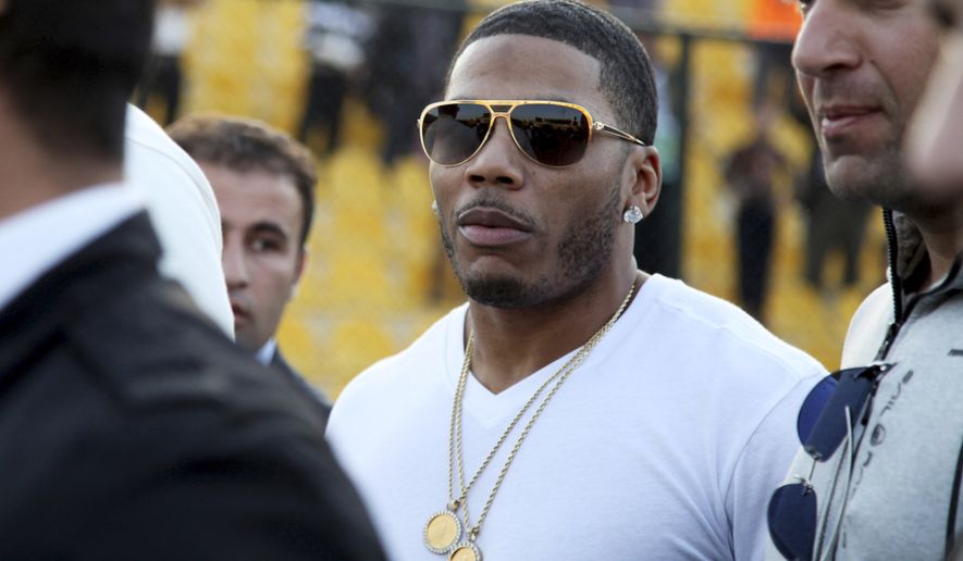 FILE- In this March 13, 2015 file photo, rapper Nelly approaches the stage for a concert in Irbil, northern Iraq. The St. Louis-based rapper is asking the federal court in his hometown to dismiss a British woman's lawsuit alleging that he sexually assaulted her after a concert in England. The lawsuit filed in November 2018 accused Nelly, whose real name is Cornell Haynes Jr., of an assault in December 2017. (AP Photo/Seivan M. Salim, File)