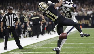 FILE-In this Sunday, Jan. 20, 2019 file photo, New Orleans Saints wide receiver Tommylee Lewis (11) works for a catch against Los Angeles Rams defensive back Nickell Robey-Coleman (23) during the second half the NFL football NFC championship game, in New Orleans. The Rams won 26-23. New Orleans Saints fans have found some pretty creative ways to express their displeasure over the infamous “no call” during last weekend’s Saints-Rams championship game. But their newest tactic may make the loudest statement - a Super Bowl boycott. (AP Photo/Gerald Herbert) ** FILE **
