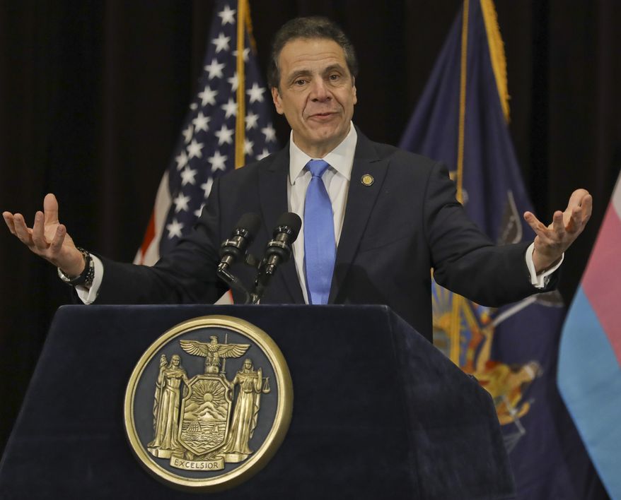 New York Gov. Andrew Cuomo speaks before signing an anti-discrimination bill into law, Friday Jan. 25, 2019 in New York. New York state added gender identity and gender expression to the state&#x27;s anti-discrimination law, making it illegal to deny people a job, housing, education or public accommodations because they are transgender. (AP Photo/Bebeto Matthews)