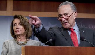 Senate Minority Leader Sen. Chuck Schumer of N.Y., accompanied by Speaker Nancy Pelosi of Calif., left, calls on a reporter during a news conference on Capitol Hill in Washington, Friday, Jan. 25, 2019, after President Donald Trump announces a deal to reopen the government for three weeks. (AP Photo/Andrew Harnik) **FILE**
