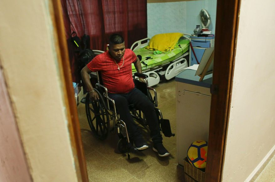 Raul Tubri leaves his room at the Good Samaritan home, a Roman Catholic-run shelter for HIV and AIDS patients, in Panama City, Saturday, Jan. 19, 2019. Like many others from his poor, indigenous region of Panama, Tugri left for the capital years ago in search of opportunities. He found work at a supermarket, but alcohol abuse sent his life into a tailspin and four years ago he was diagnosed with HIV. (AP Photo/Arnulfo Franco)