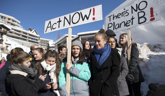 Students protest during a &#39;School Strike 4 Climate&#39; in front of the Congress Center at the last day of the 49th annual meeting of the World Economic Forum, WEF, in Davos, Switzerland, Friday, Jan. 25, 2019. (Laurent Gillieron/Keystone via AP)