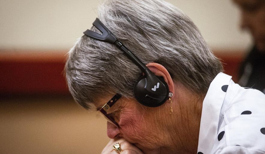 Pattie Bastian, Jennifer Bastian's mother, listens as Robert Washburn, 61, pleads guilty to first-degree murder for Jennifer Bastian's death in Tacoma, Wash., on Friday, Jan. 25, 2019. (Joshua Bessex/The Tacoma News Tribune via AP)
