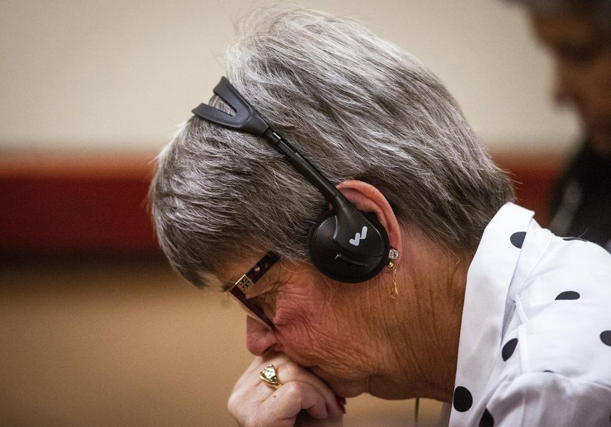Pattie Bastian, Jennifer Bastian's mother, listens as Robert Washburn, 61, pleads guilty to first-degree murder for Jennifer Bastian's death in Tacoma, Wash., on Friday, Jan. 25, 2019. (Joshua Bessex/The Tacoma News Tribune via AP)