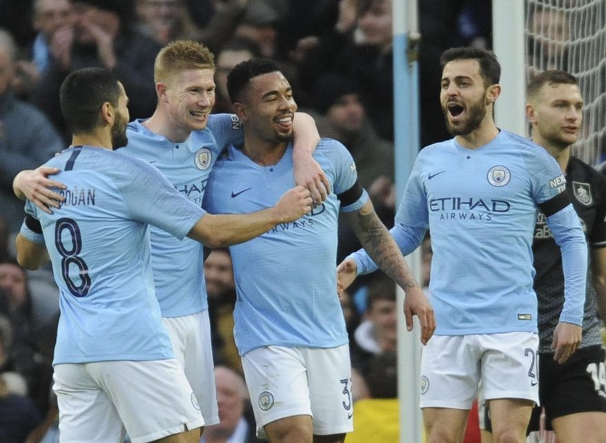 Left to right, Manchester City&#39;s Ilkay Gundogan, Kevin De Bruyne, Gabriel Jesus and Manchester City&#39;s Bernardo Silva celebrate after scoring their side&#39;s opening goal during the FA Cup 4th round soccer match between Manchester City and Burnley at Etihad stadium in Manchester, England, Saturday, Jan. 26, 2019. (AP Photo/Rui Vieira)