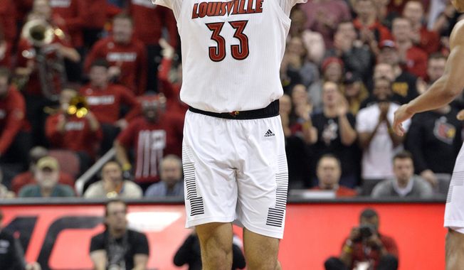Louisville forward Jordan Nwora (33) motions to the crowd following a basket during the second half of an NCAA college basketball game against Pittsburgh in Louisville, Ky., Saturday, Jan. 26, 2019. Louisville won 66-51. AP Photo/Timothy D. Easley)