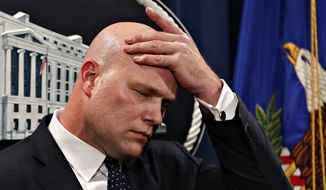 Acting Attorney General Matt Whitaker, wipes his brow after making an announcement of an indictment of Chinese telecommunications companies including Huawei, on violations including bank and wire fraud, Monday, Jan. 28, 2019, at the Justice Department in Washington. (AP Photo/Jacquelyn Martin) ** FILE **