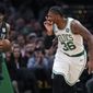 Boston Celtics guard Marcus Smart (36) taunts the Brooklyn Nets bench after hitting a three-point shot during the first quarter of an NBA basketball game in Boston, Monday, Jan. 28, 2019. (AP Photo/Charles Krupa)