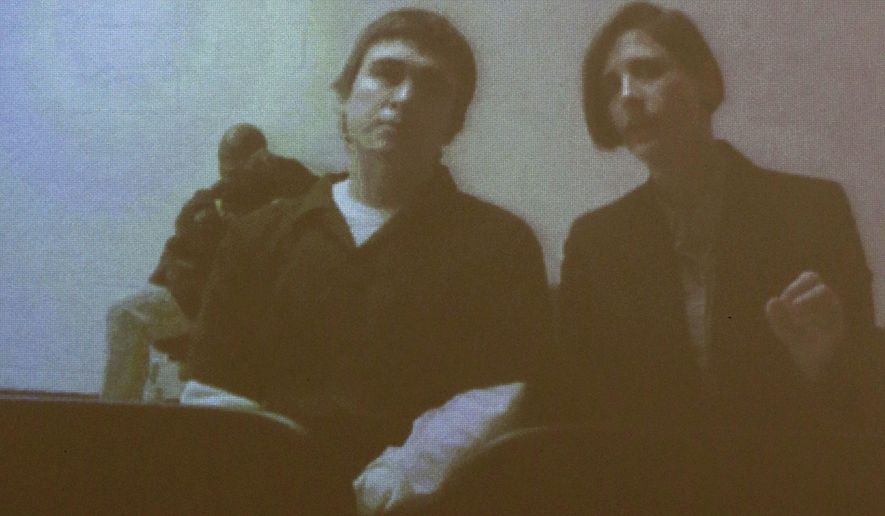 Dimitrios Pagourtzis, the student accused of killing 10 people in a May 18, 2018, shooting at Santa Fe High School, appears via teleconference with defense attorney Katy-Marie Lyles for a status conference at the Galveston County Courthouse in Galveston, Texas, on Monday, Jan. 28, 2019. Pagourtzis' attorneys have filed a motion for a change of venue. (Jennifer Reynolds/The Galveston County Daily News via AP, Pool)