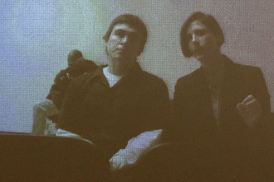 Dimitrios Pagourtzis, the student accused of killing 10 people in a May 18, 2018, shooting at Santa Fe High School, appears via teleconference with defense attorney Katy-Marie Lyles for a status conference at the Galveston County Courthouse in Galveston, Texas, on Monday, Jan. 28, 2019. Pagourtzis' attorneys have filed a motion for a change of venue. (Jennifer Reynolds/The Galveston County Daily News via AP, Pool)