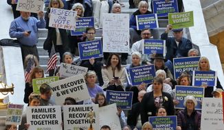 Supporters of a voter-approved measure to fully expand Medicaid gather at a rally to ask lawmakers not to change the law during the first day of the Utah Legislature, at the Utah State Capitol, Monday, Jan. 28, 2019, in Salt Lake City. (AP Photo/Rick Bowmer)