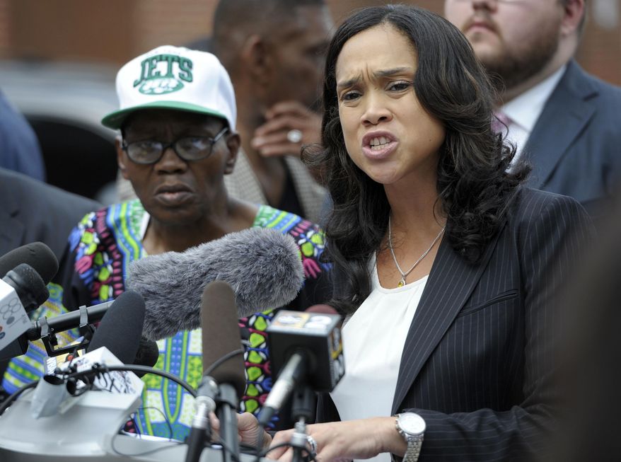 In this July 27, 2016, file photo, Baltimore State&#x27;s Attorney Marilyn Mosby, right, holds a news conference near the site where Freddie Gray was arrested after her office dropped the remaining charges against three Baltimore police officers awaiting trial in Gray&#x27;s death, in Baltimore. Mosby will no longer prosecute any marijuana possession cases, regardless of the quantity of the drug or an individual’s prior criminal record, authorities announced Tuesday, Jan. 29, 2019. (AP Photo/Steve Ruark) ** FILE **
