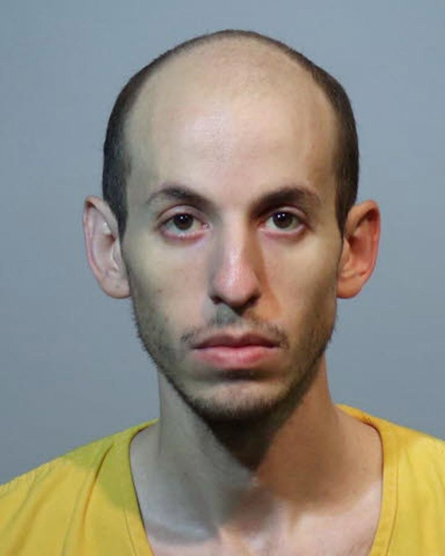In this Jan. 28, 2019 photo made available by the Seminole County Sheriff's Office, Grant Amato is under arrest. Amaro killed his parents and brother after he was kicked out of his home after stealing $210,000 from his family to send to a woman he had met on a porn site. Amato has been charged with three counts of first-degree murder. (Seminole County Sheriff's Office via AP)
