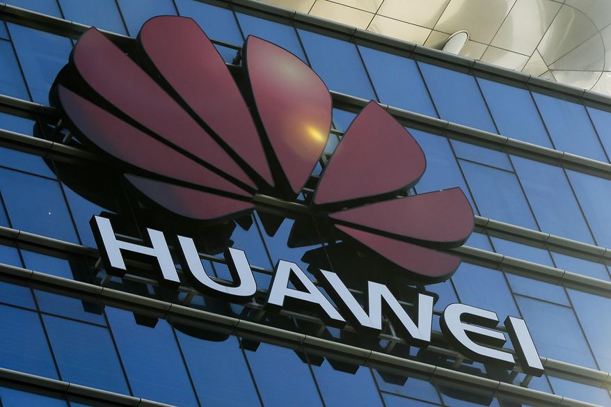 In perhaps its largest action, the Justice Department hit the Chinese telecommunications company Huawei with a slew of charges, including stealing trade secrets from T-Mobile. (Associated Press/File)