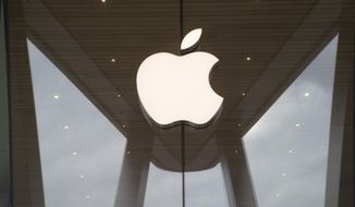 FILE- In this Jan. 3, 2019, file photo the Apple logo is displayed at the Apple store in the Brooklyn borough of New York. Apple Inc. reports earnings Tuesday, Jan. 29. (AP Photo/Mary Altaffer, File)
