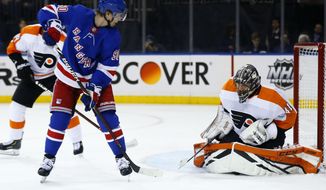Philadelphia Flyers goaltender Anthony Stolarz (41) makes a save under his pads on a shot by New York Rangers center Vladislav Namestnikov (90) in the second period of an NHL hockey game Tuesday, Jan. 29, 2019, in New York. (AP Photo/Adam Hunger)