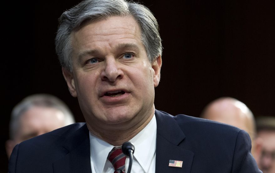 FBI Director Christopher Wray testifies before the Senate Intelligence Committee on Capitol Hill in Washington Tuesday, Jan. 29, 2019. (AP Photo/Jose Luis Magana)