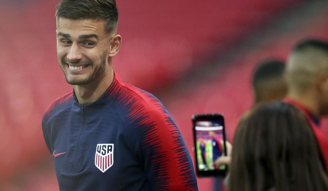 FILE - In this Nov. 14, 2018, file photo, United States national soccer team player Matt Miazga has his picture taken during a training session at Wembley Stadium in London. Miazga has been recalled by Chelsea from his unsuccessful loan to Nantes in France's Ligue 1 and loaned for the rest of the season to relegation-threatened Reading in England's second-tier League Championship. (AP Photo/Tim Ireland, File)