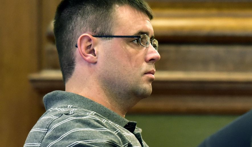 File - In this Oct. 28, 2016, file photo, Cody Marble sits in the gallery during a hearing on his case in Missoula District Court, in Missoula, Mont. A retired District Court judge has overturned Marble's conviction for a 2002 rape at the juvenile detention center in Missoula. (Tom Bauer/The Missoulian via AP, File)