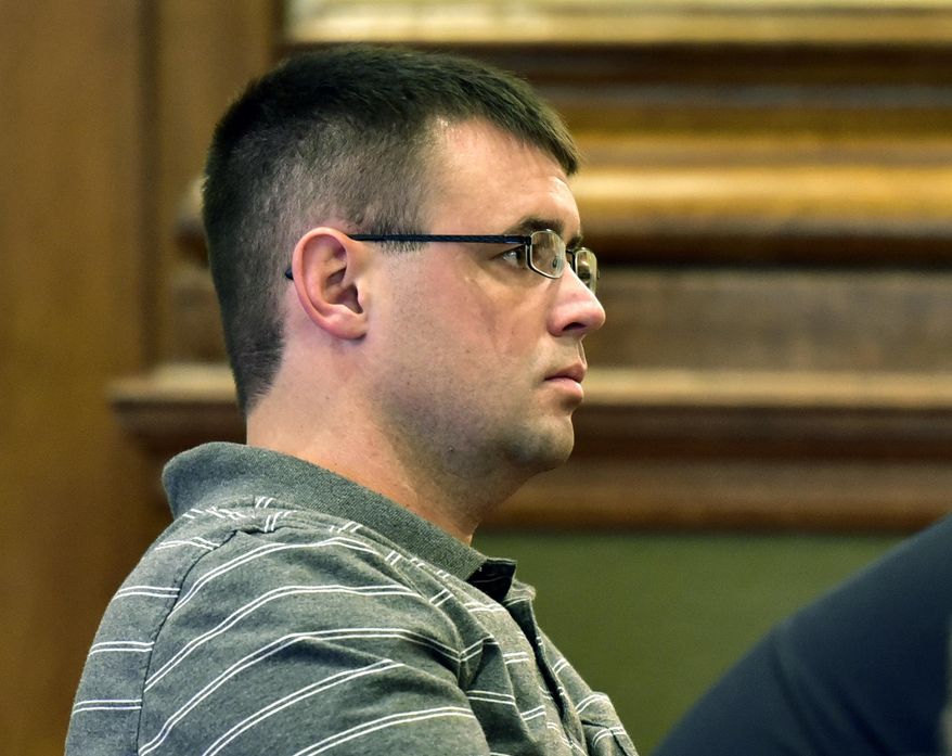 File - In this Oct. 28, 2016, file photo, Cody Marble sits in the gallery during a hearing on his case in Missoula District Court, in Missoula, Mont. A retired District Court judge has overturned Marble's conviction for a 2002 rape at the juvenile detention center in Missoula. (Tom Bauer/The Missoulian via AP, File)