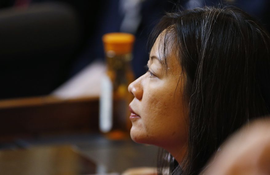 Del. Kathy Tran, D-Fairfax, applauds a speech on the floor of the House during session at the Capitol in Richmond, Va., Wednesday, Jan. 30, 2019. Tran's abortion bill is erupting into a fierce partisan clash as video of a legislative hearing goes viral. (AP Photo/Steve Helber)