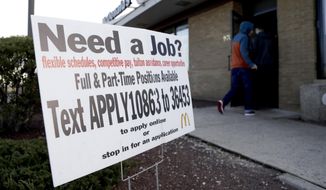 In this Jan. 3, 2019, photo customers enter a McDonald&#39;s restaurant near an employment sign in Atlantic Highlands, N.J. On Wednesday, Jan. 30, payroll processor ADP reports how many jobs private employers added in January. (AP Photo/Julio Cortez, File)