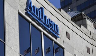 FILE - In this Feb. 5, 2015, file photo, the Anthem logo hangs at the health insurer&#39;s corporate headquarters in Indianapolis. Anthem Inc., reports earnings Wednesday, Jan. 30, 2019. (AP Photo/Michael Conroy, File)