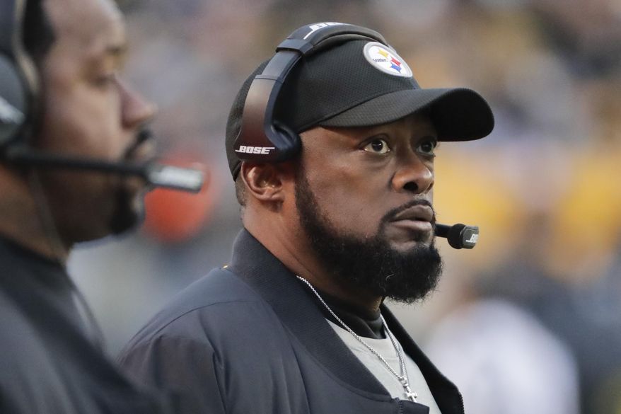 File- This Dec. 30, 2018, file photo shows, Pittsburgh Steelers head coach Mike Tomlin during an NFL football game against the Cincinnati Bengals, in Pittsburgh. With only a handful of minorities in the stepping-stone positions of offensive coordinator and quarterbacks coach, the NFL saw its sharpest-ever one-year drop in minority head coaches, causing concern among advocates for diversity declaring unsatisfactory progress 16 years after the Rooney Rule was implemented. (AP Photo/Gene J. Puskar, File)