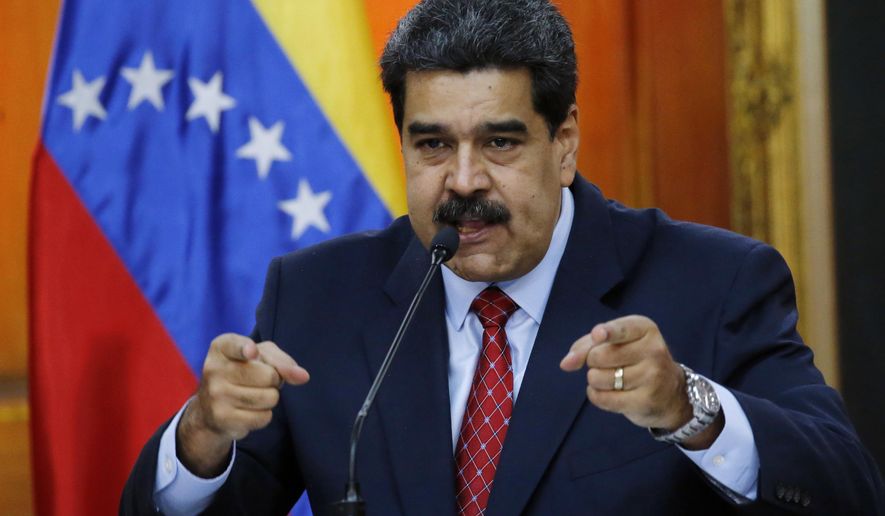 FILE - In this file photo dated Friday, Jan. 25, 2019, Venezuelan President Nicolas Maduro gives a press conference at Miraflores presidential palace in Caracas, Venezuela. More than a week into a political standoff, Venezuelan President Nicolas Maduro said Wednesday Jan. 30, 2019, that he is willing to negotiate with opposition leader Juan Guaido. (AP Photo/Ariana Cubillos, FILE)