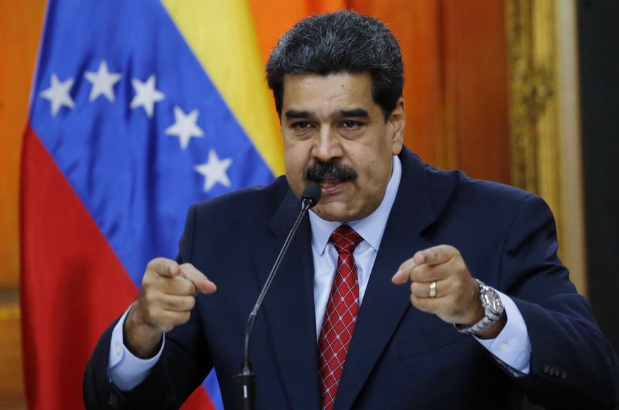 FILE - In this file photo dated Friday, Jan. 25, 2019, Venezuelan President Nicolas Maduro gives a press conference at Miraflores presidential palace in Caracas, Venezuela. More than a week into a political standoff, Venezuelan President Nicolas Maduro said Wednesday Jan. 30, 2019, that he is willing to negotiate with opposition leader Juan Guaido. (AP Photo/Ariana Cubillos, FILE)