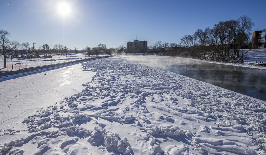 Bitter cold creates icy conditions on the Saint Joseph River, near Howard Park, on Thursday, Jan. 31, 2019, in South Bend, Ind. (Robert Franklin/South Bend Tribune via AP)