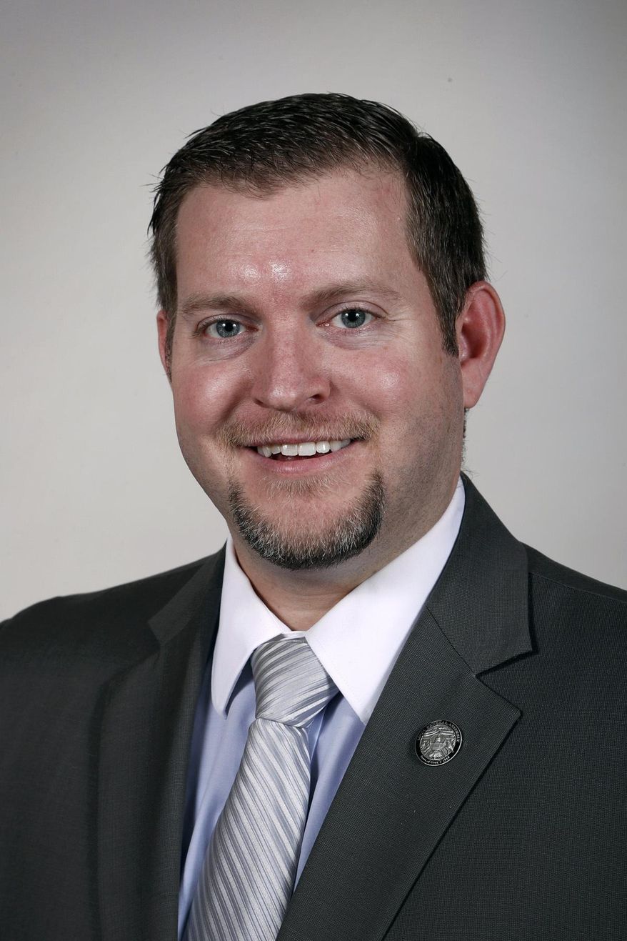 FILE - In this Feb. 8, 2017, file photo State Sen. Jake Chapman, R-Adel, poses at the Statehouse in Des Moines, Iowa. A majority of legislators in the Iowa Senate, frustrated at repeated court rulings declaring anti-abortion laws unconstitutional, have introduced a proposed amendment to the Iowa Constitution that would declare it "does not secure or protect a right to abortion." The proposed amendment was introduced Jan. 24, 2019, by Chapman two days after a state court judge struck down yet another attempt by the Legislature to limit abortion. (AP Photo/Charlie Neibergall, File)