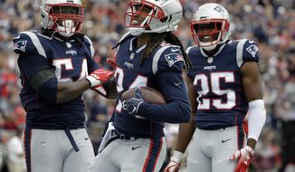 FILE - In this Sept. 9, 2018, file photo, New England Patriots defensive back Stephon Gilmore, center, celebrates his interception with Dont&#39;a Hightower, left, and Eric Rowe, right, during the first half of an NFL football game against the Houston Texans in Foxborough, Mass. 2018 has been a signature season for one of the quietest players in their locker room. Gilmore earned All-Pro honors for the first time in his career and taken the leadership reins of a secondary that lost Malcolm Butler in free agency this past offseason. (AP Photo/Steven Senne, File)