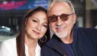 FILE - In this July 9, 2018 file photo, Gloria and Emilio Estefan pose for a portrait at BiteSize Studio in Los Angeles. The Estefans will receive the Library of Congress Gershwin Prize for Popular Song in May. They are the first married couple and musicians-songwriters of Hispanic descent to receive the honor. (Photo by Rebecca Cabage/Invision/AP, File)