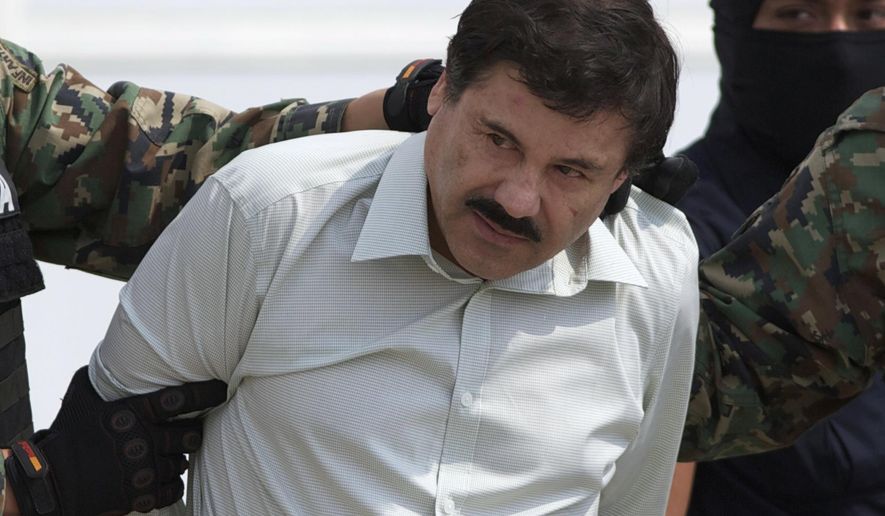 FILE - This Feb. 22, 2014 file photo shows Joaquin "El Chapo" Guzman, the head of Mexico's Sinaloa Cartel, being escorted to a helicopter in Mexico City following his capture in the beach resort town of Mazatlan. Newly unsealed documents in the U.S. case against the Mexican drug lord say that witnesses have described him having sex with minors. According to papers unsealed Friday, Feb. 1, 2019, one witness told authorities that Joaquin Guzman had him drug girls as young as 13 before Guzman had sex with them in the late 2000s in Mexico. (AP Photo/Eduardo Verdugo, File)