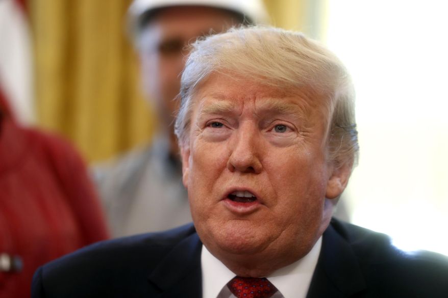 In this Jan. 31, 2019, photo, President Donald Trump speaks during a meeting with American manufacturers in the Oval Office of the White House in Washington. (AP Photo/Jacquelyn Martin)